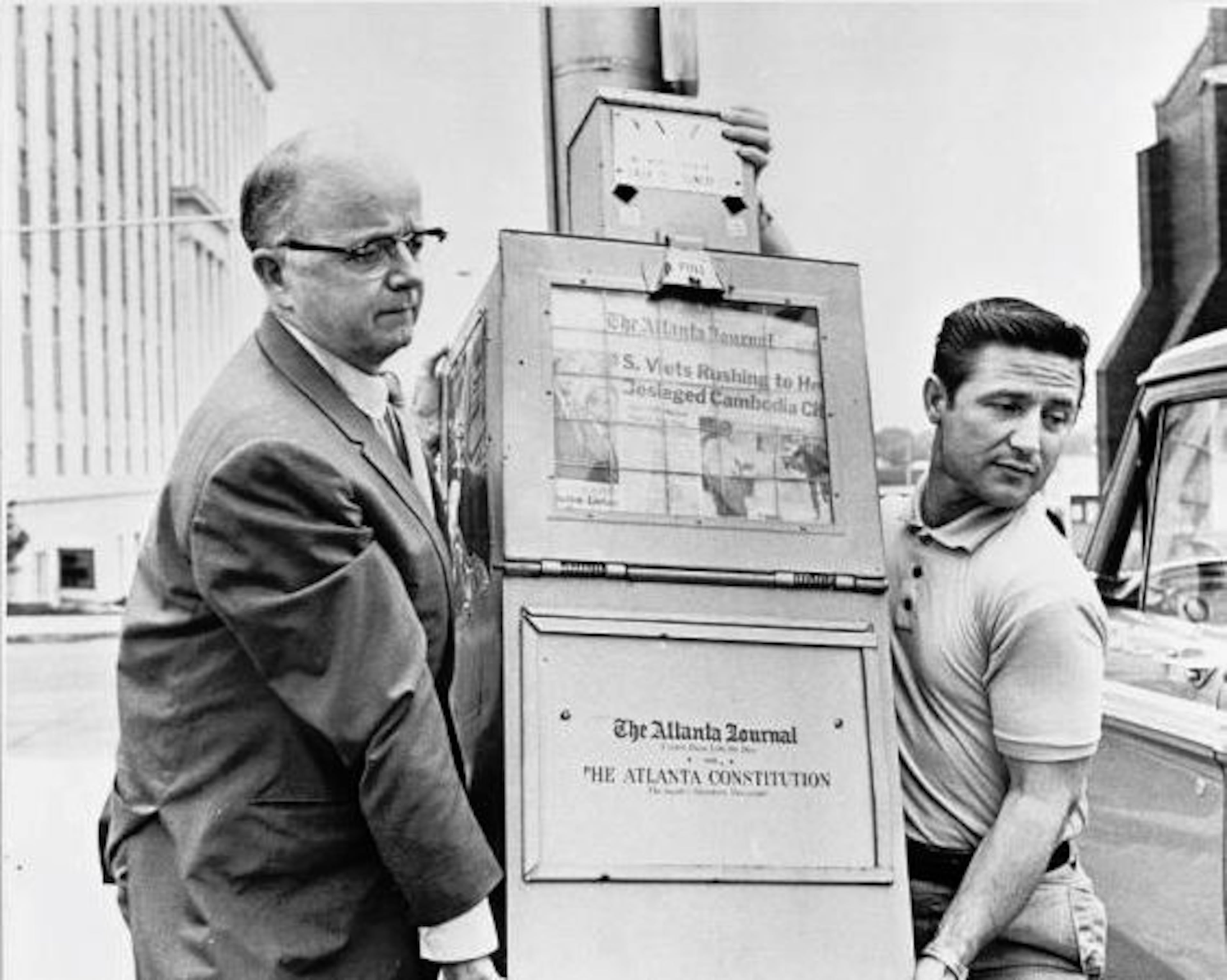 Gov. Lester Maddox (left) ordered a ban on The Atlanta Journal and The Atlanta Constitution vending machines from the state office complex. (AJC file)