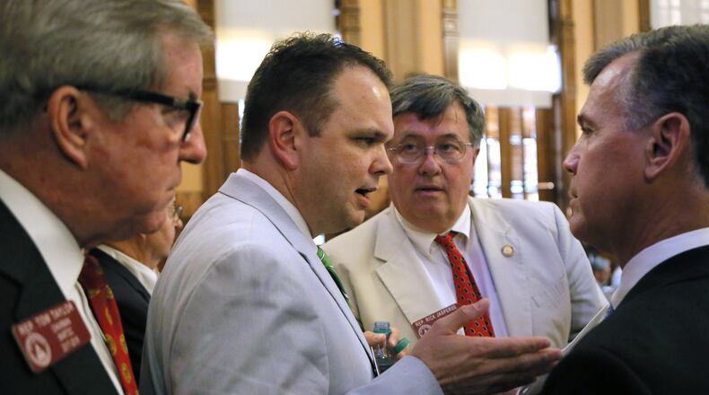 House Majority Whip Christian Coomer, second from left, said of Senate Bill 452: “If the state’s interest in reasonable law enforcement approaches to criminal aliens and misdemeanor bail issues remains high, then another version of the bill may see movement next year.” BOB ANDRES /BANDRES@AJC.COM