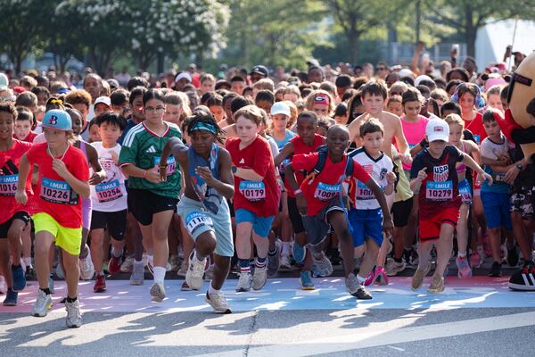 The next generation of Peachtree runners gets off to a fast start during Friday's Peachtree Junior race. (Ben Gray for the AJC)