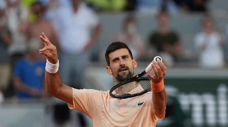 Novak Djokovic of Serbia celebrates after winning against Valentin Royer of France during their second round men's singles tennis match at the French Open tennis tournament in Paris, Wednesday, May 27, 2026. (AP Photo/Thibault Camus)