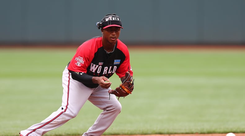CINCINNATI, OH - JULY 12: Ozhaino Albies #7 of the World Team fields a ground ball during batting practice before the SiriusXM All-Star Futures Game at the Great American Ball Park on July 12, 2015 in Cincinnati, Ohio. (Photo by Elsa/Getty Images)