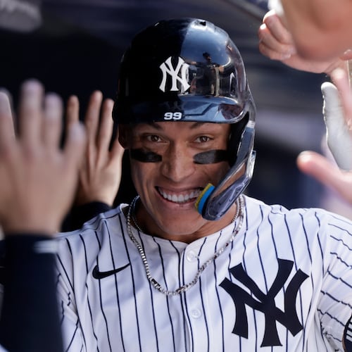 FILE - New York Yankees' Aaron Judge is congratulated after hitting a two-run home run during the seventh inning of a baseball game against the Athletics, Sunday, June 29, 2025, in New York. (AP Photo/Adam Hunger, File)