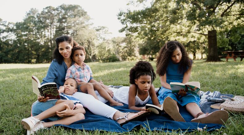 Amber O’Neal Johnston of Cobb County home-schools her four children and shares her observations on education, living books, and home schooling at HeritageMom.com, and connects with followers on Instagram (@heritagemomblog). (Courtesy of Nicole Eliason)