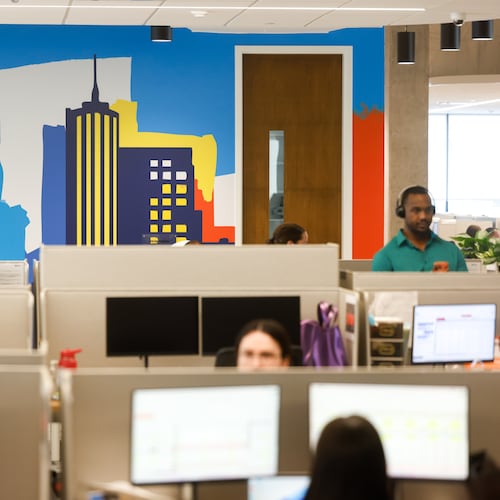 Employees work at the new TriNet office in Dunwoody on Aug. 18, 2026. The company plans to eventually house 750 employees at its offices within the High Street development. (Arvin Temkar/AJC)