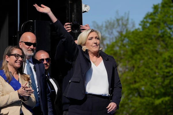 French far-right leader Marine Le Pen arrives as she attends at the French far-right party national rally near the parliament in Paris, Sunday, April 6, 2025. (AP Photo/Michel Euler)