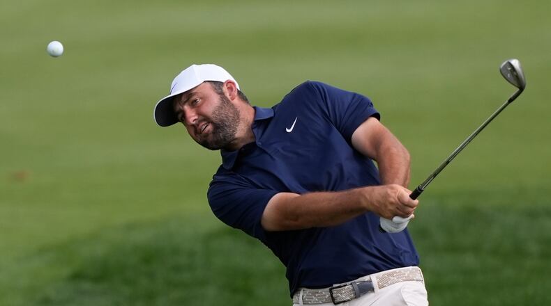 Scottie Scheffler hits from the second fairway during the final round of The Players Championship golf tournament, Sunday, March 15, 2026, in Ponte Vedra Beach, Fla. (AP Photo/Gerald Herbert)