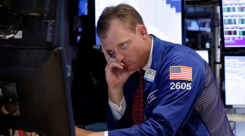 Specialist Edward Zelles works on the floor of the New York Stock Exchange, Thursday, Aug. 20, 2015. The Dow Jones industrial average slid 358 points, also 2.1 percent, to 16,990. (AP Photo/Richard Drew)