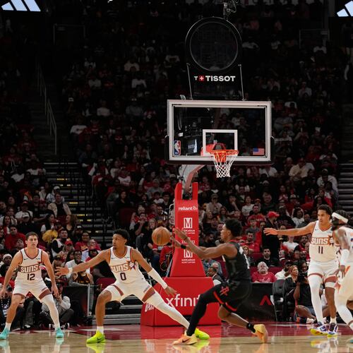 Play continues with the shot clock not working during the first half of an NBA basketball game between the Phoenix Suns and Houston Rockets Monday, Jan. 5, 2026, in Houston. (AP Photo/David J. Phillip)