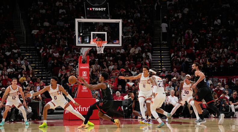 Play continues with the shot clock not working during the first half of an NBA basketball game between the Phoenix Suns and Houston Rockets Monday, Jan. 5, 2026, in Houston. (AP Photo/David J. Phillip)