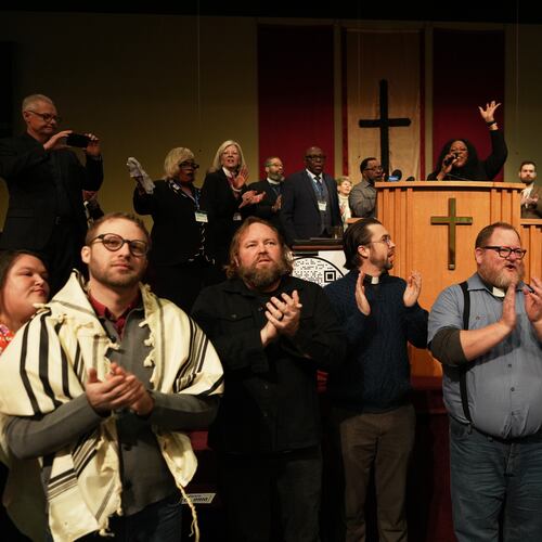 Faith leaders from across the United States sing together as a sign of support for Haitian migrants fearing the end of their Temporary Protected Status in the U.S., at an event held at St. John Missionary Baptist Church in Springfield, Ohio, on Monday, Feb. 2, 2026. (AP Photo/Luis Andres Henao)