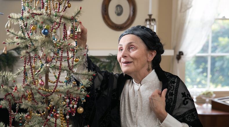 Actress Holly Stevenson performs as Eva Baker during a dress rehearsal of “The Bridesmaid of Barrington Hall, ” in the drawing room at Barrington Hall. The performance is a one-woman show where Stevenson portrays Margaret Mitchell, Eva Baker, and President Theodore Roosevelt. Photo credit: Jason Getz