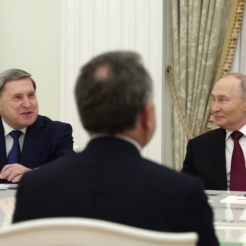 Russian President Vladimir Putin, right, and Russian Presidential foreign policy adviser Yuri Ushakov, left, attend the talks with U.S. special envoy Steve Witkoff, back to a camera, at the Senate Palace of the Kremlin in Moscow, Russia, Tuesday, Dec. 2, 2025. (Alexander Kazakov, Sputnik, Kremlin Pool Photo via AP)