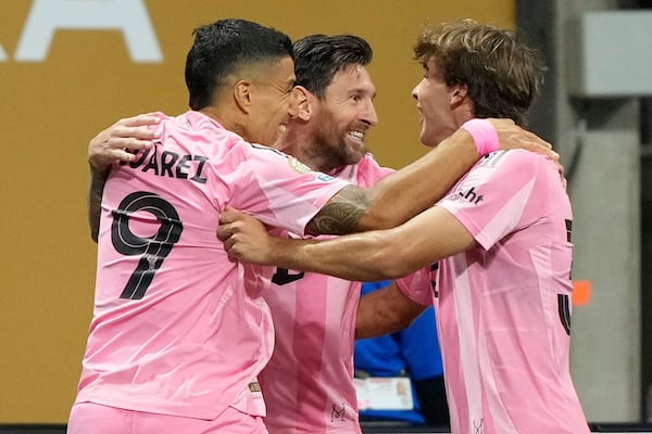 Inter Miami's Lionel Messi, center, celebrates after scoring his side's second goal during the Club World Cup group A soccer match between Inter Miami and FC Porto in Atlanta, Thursday, June 19, 2025. (AP Photo/Brynn Anderson)