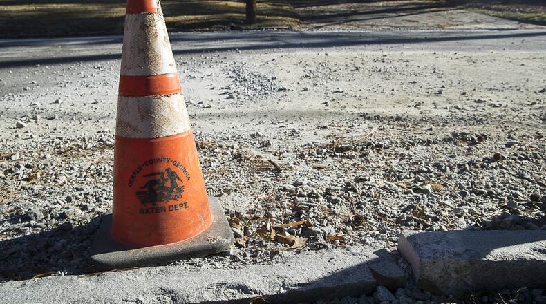 A DeKalb County Department of Watershed Management traffic cone. (ALYSSA POINTER/ALYSSA.POINTER@AJC.COM)