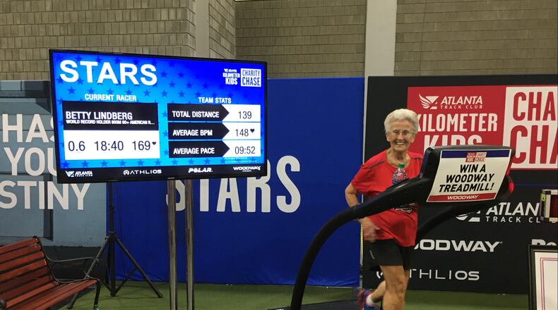 Betty Lindberg runs on a treadmill during a charity event. She will run her 28th Atlanta Journal-Constitution Peachtree road race this year. (Contributed)