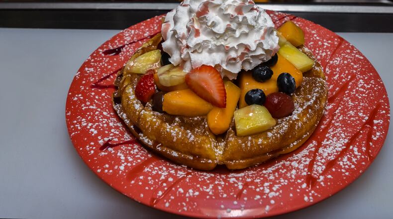 Stop by Peachtree Cafe in Lawrenceville for a Belgian waffle topped with fruit, whipped cream and powdered sugar. Photo credit: Peachtree Cafe