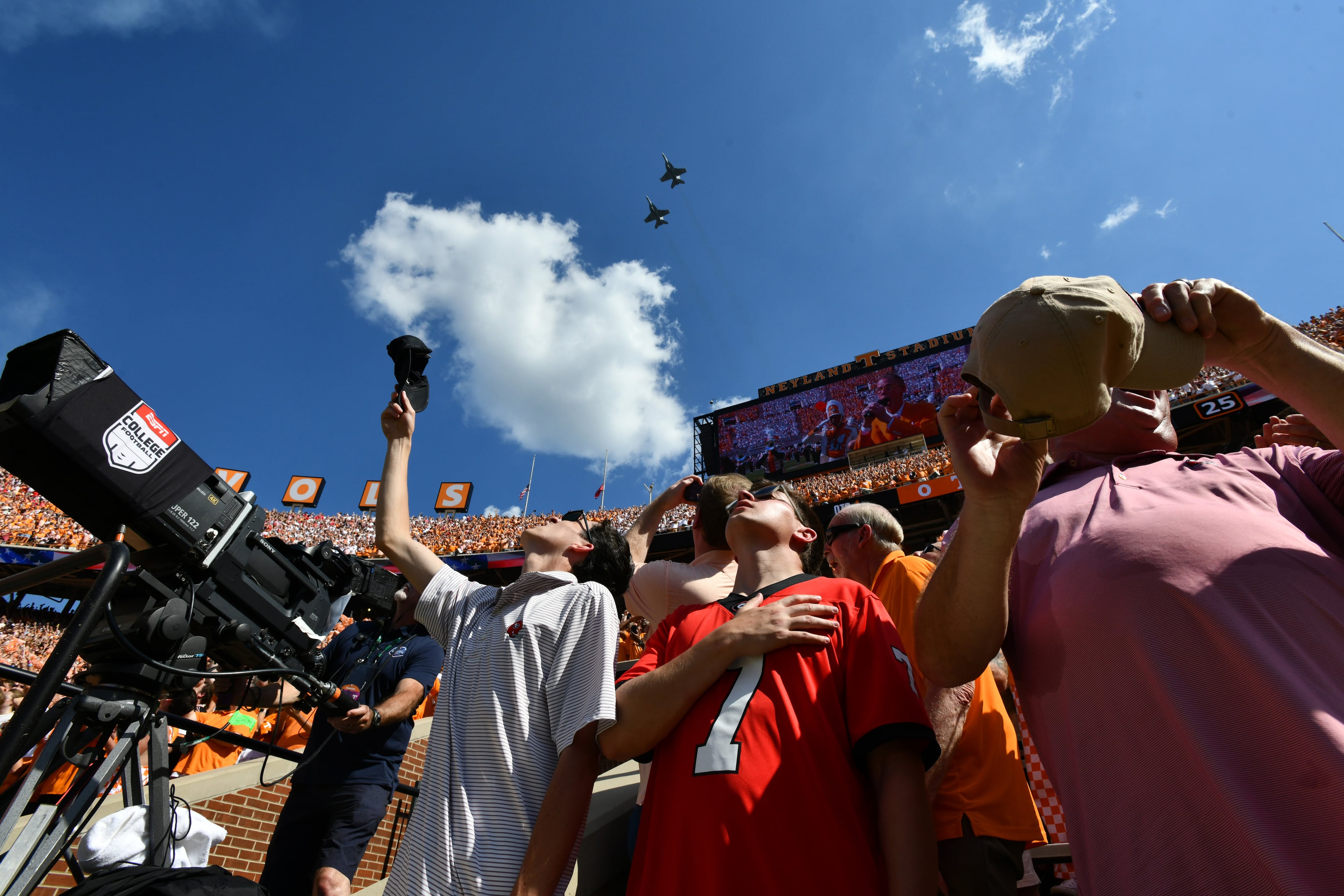 Fans watch the flyover before the game between Georgia and Tennessee at Neyland Stadium on Saturday, Sept. 13, 2025, in Knoxville, Tenn. (Hyosub Shin/AJC)