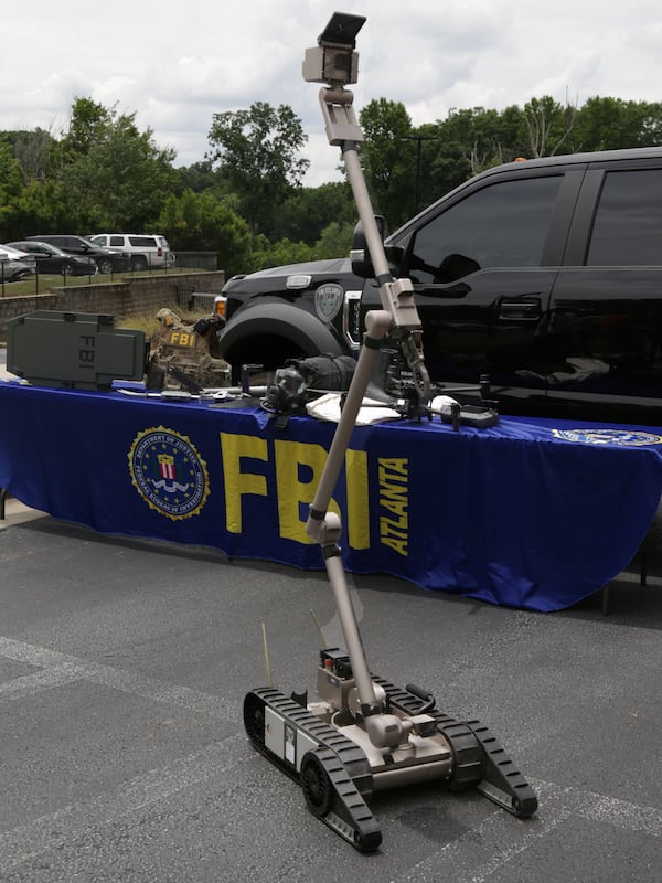 A bomb-detecting robot is shown during a press conference addressing the FBI’s safety plans for the 2026 FIFA World Cup in Atlanta. (Akili-Casundria Ramsess for the AJC)