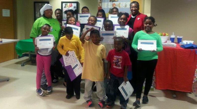 Fulton County Commissioner Joan Garner with children who have completed a nutrition class.