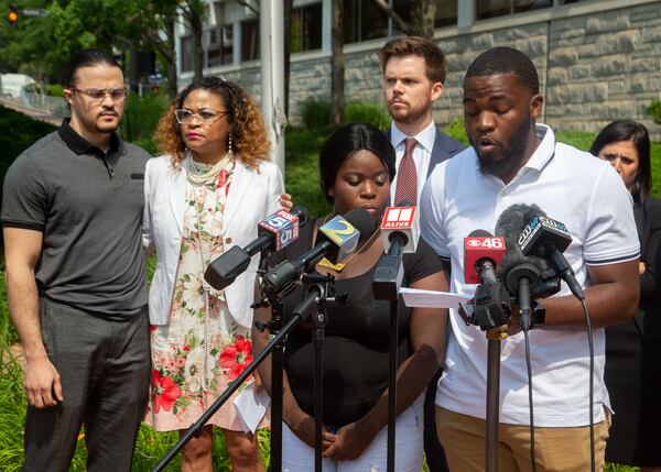 Johnny Bolton's son Kyrie Turner and daughter Diamond Bolton speak at a press conference in front of the Cobb County sheriff's office in Marietta on Tuesday, May 25, 2021.   STEVE SCHAEFER FOR THE ATLANTA JOURNAL-CONSTITUTION