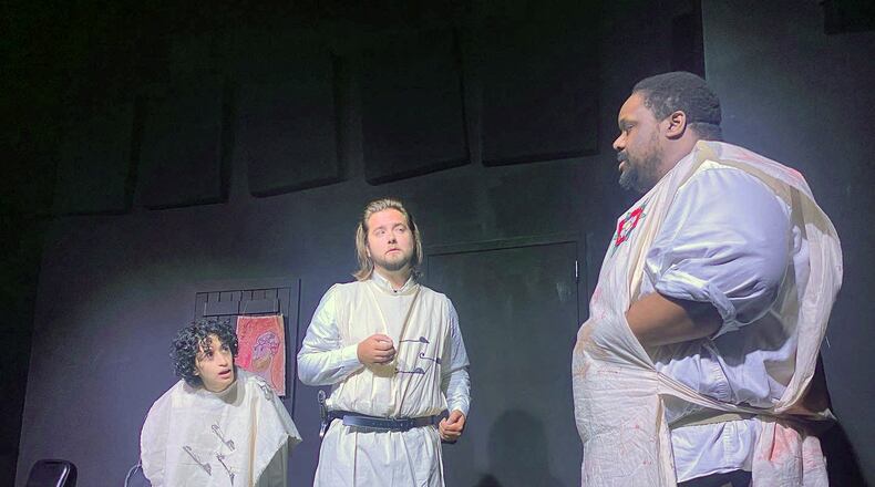 Comedic operators: Archibald (Drew Turner, center) and Ashley (Brandon Stringfield, right) discuss early medicine as Jack (Summer Adhal, left) takes mental notes in the Village Theatre's improv comedy show "Medieval ER." (Photo by Jordan Owen)