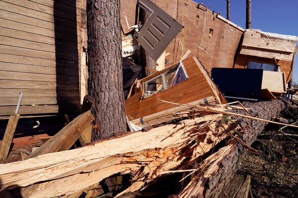 The frame of this mobile home is wrapped around a tree following Saturday's tornado that struck the Paradise Ranch RV Resort in Tylertown, Miss., Sunday, March 16, 2025. (AP Photo/Rogelio V. Solis)