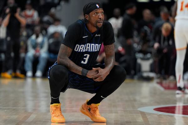 Orlando Magic guard Kentavious Caldwell-Pope (3) reacts to play against the Atlanta Hawks during the first half of an NBA basketball game, Sunday, April 13, 2025, in Atlanta. (AP Photo/Mike Stewart)
