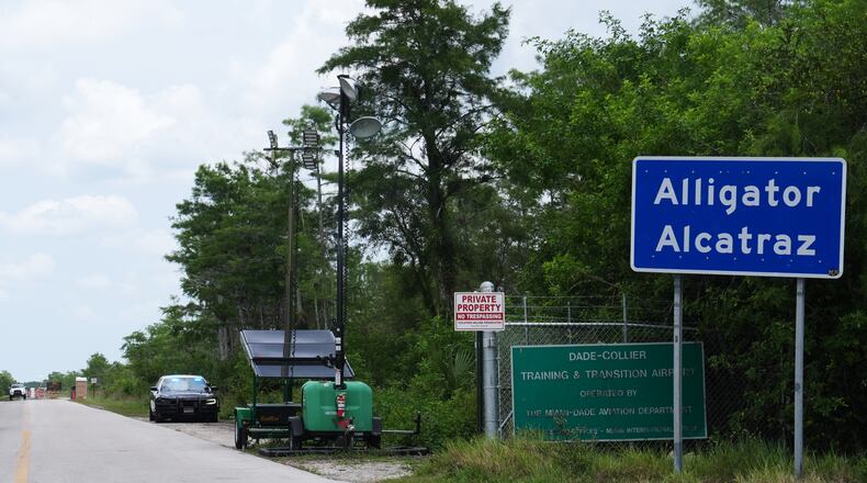 A Florida Highway Patrol car guards the entrance to the "Alligator Alcatraz" detention center Monday, May 11, 2026, in Ochopee, Fla. (AP Photo/Marta Lavandier)