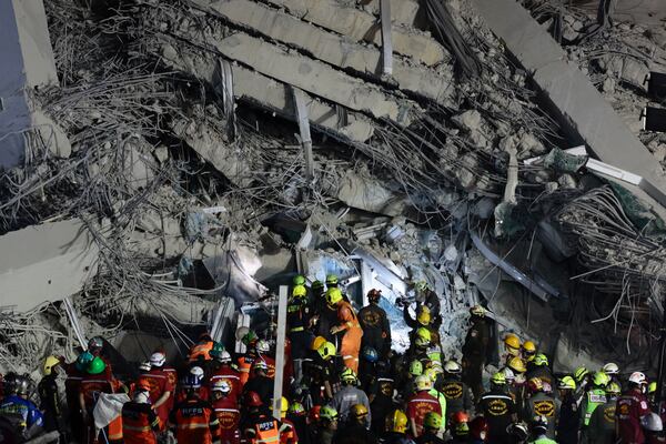 Rescuers work at the site a high-rise building under construction that collapsed after a 7.7 magnitude earthquake in Bangkok, Thailand, early Saturday, March 29, 2025. (AP Photo/Wason Wanichakorn)
