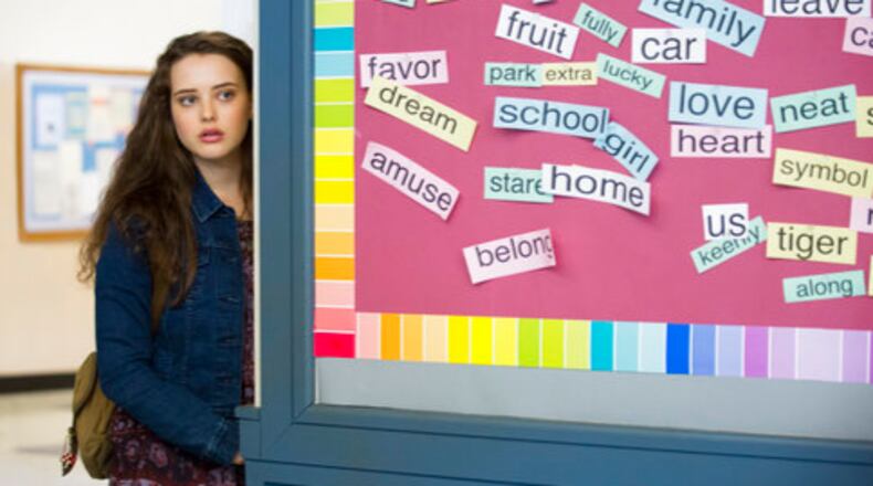 This image released by Netflix shows Katherine Langford in a scene from the series, "13 Reasons Why," about a teenager who commits suicide. The stomach-turning suicide scene has triggered criticism from some mental health advocates that it romanticizes suicide and even promoted many schools across the country to send warning letters to parents and guardians. The showâs creators are unapologetic, saying their frank depiction of teen life needs to be âunflinching and raw.â (Beth Dubber/Netflix via AP)