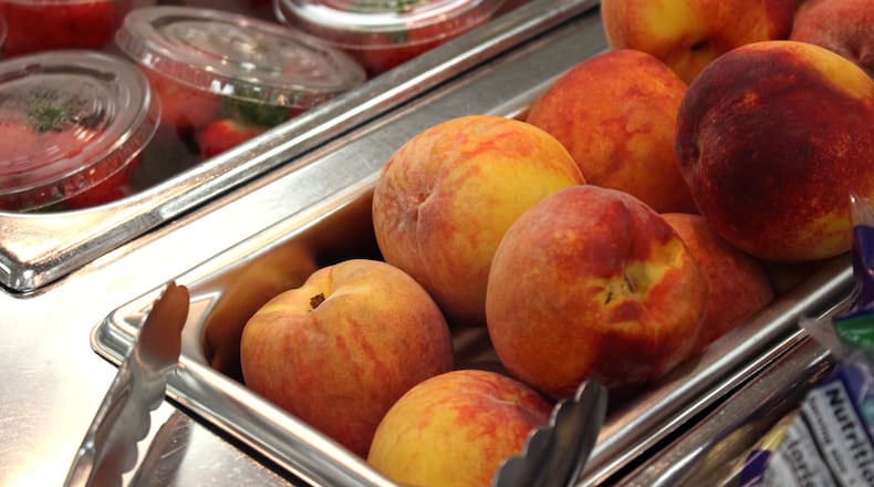 Parkview High School serves peaches that were locally sourced on Tuesday, Aug. 28, 2018. The cafeteria has one to two deliveries of fresh produce a week to provide a variety of fresh fruits and vegetables, says Karen Hallford, the assistant director of the Gwinnett County school nutrition program.JENNA EASON / Jenna.Eason@coxinc.com