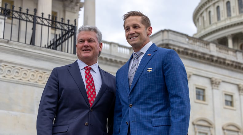 Newly elected Reps. Mike Collins (R-GA), and Rich McCormick (R-GA) take photos on the steps of the U.S. Capitol in Washington, DC on November 15th, 2022. On Nov. 14, 2023, both voted against a measure to temporarily fund the government and avoid a shutdown.