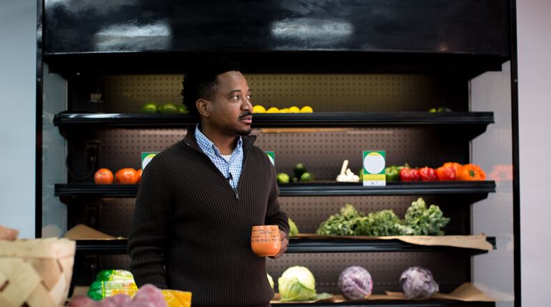 November 22, 2016 — Maurice Burrell, owner of Peach Pantry, a corner store in southwest Atlanta, has started to sell fresh fruits and vegetables in order to offer healthier options for customers in the neighborhood. (photo: BRANDEN CAMP/SPECIAL)