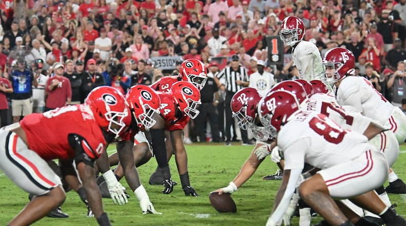 Georgia and Alabama line up at the line of scrimmage at Sanford Stadium on Saturday, Sept. 27, 2025, in Athens. The No. 3-ranked Bulldogs and the No. 9-ranked Crimson Tide have had plenty to handle leading up to the SEC championship game. (Hyosub Shin/AJC)