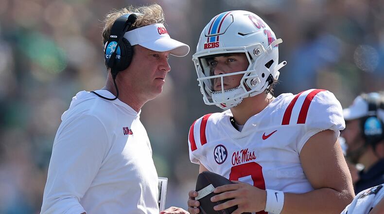 Jaxson Dart (2) (right) of the Mississippi Rebels and head coach Lane Kiffin talk during the first half at Yulman Stadium on Sept. 9, 2023, in New Orleans. (Jonathan Bachman/Getty Images/TNS)