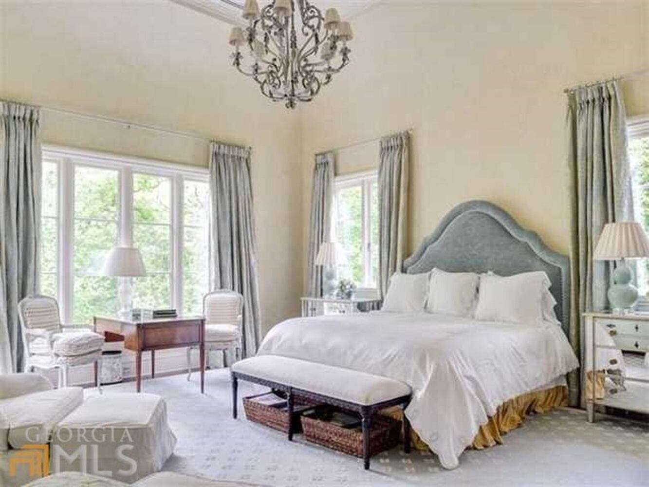 Each of the four roomy upper level bedrooms includes a private bath and walk-in closet.