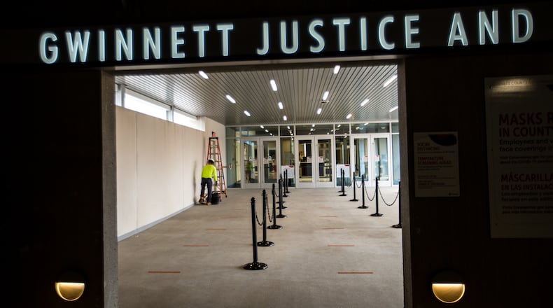 The Gwinnett Justice and Administration Center is near the end of a more than $80 million expansion Wednesday, March 24, 2021 with a new entry directly from the parking deck.  The addition provides additional court rooms, secure space for the DA, judges chambers, larger entrance from the parking deck, easy access when reporting for jury duty, new holding cells and transportation bay for incarcerated defendants.  The SPLOST money provided for the 5-story building and parking deck and has been in development since 2019. (Jenni Girtman for The Atlanta Journal-Constitution)