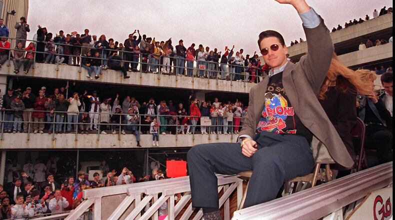Tom Glavine, the World Series' MVP, acknowledges some of the estimated half-million fans who turned out for the Braves 1995 victory parade. (AJC file/Renee Hannans)