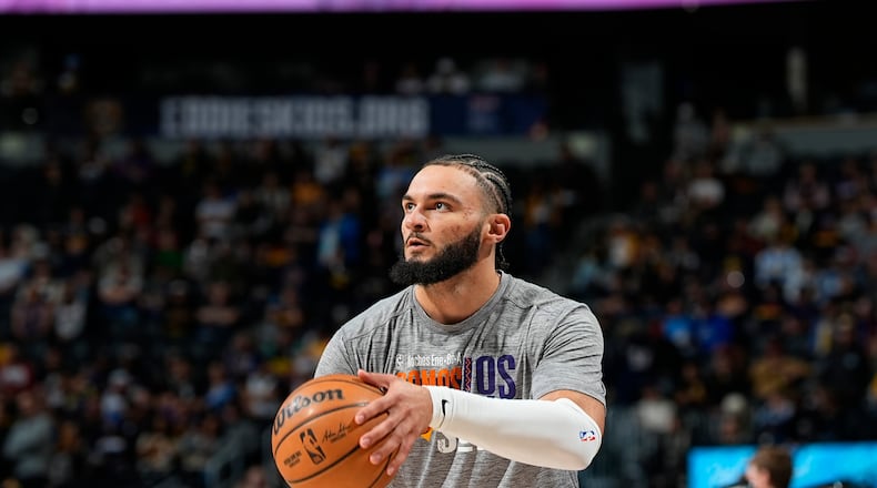 Phoenix Suns forward David Roddy (21) in the first half of an NBA basketball game Tuesday, March 5, 2024, in Denver. (AP Photo/David Zalubowski)