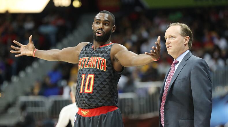 Tim Hardaway Jr. confers with head coach Mike Budenholzer during the first period against the Lakers in an NBA basketball game at Philips Arena on Wednesday, Nov. 2, 2016, in Atlanta. Curtis Compton /ccompton@ajc.com