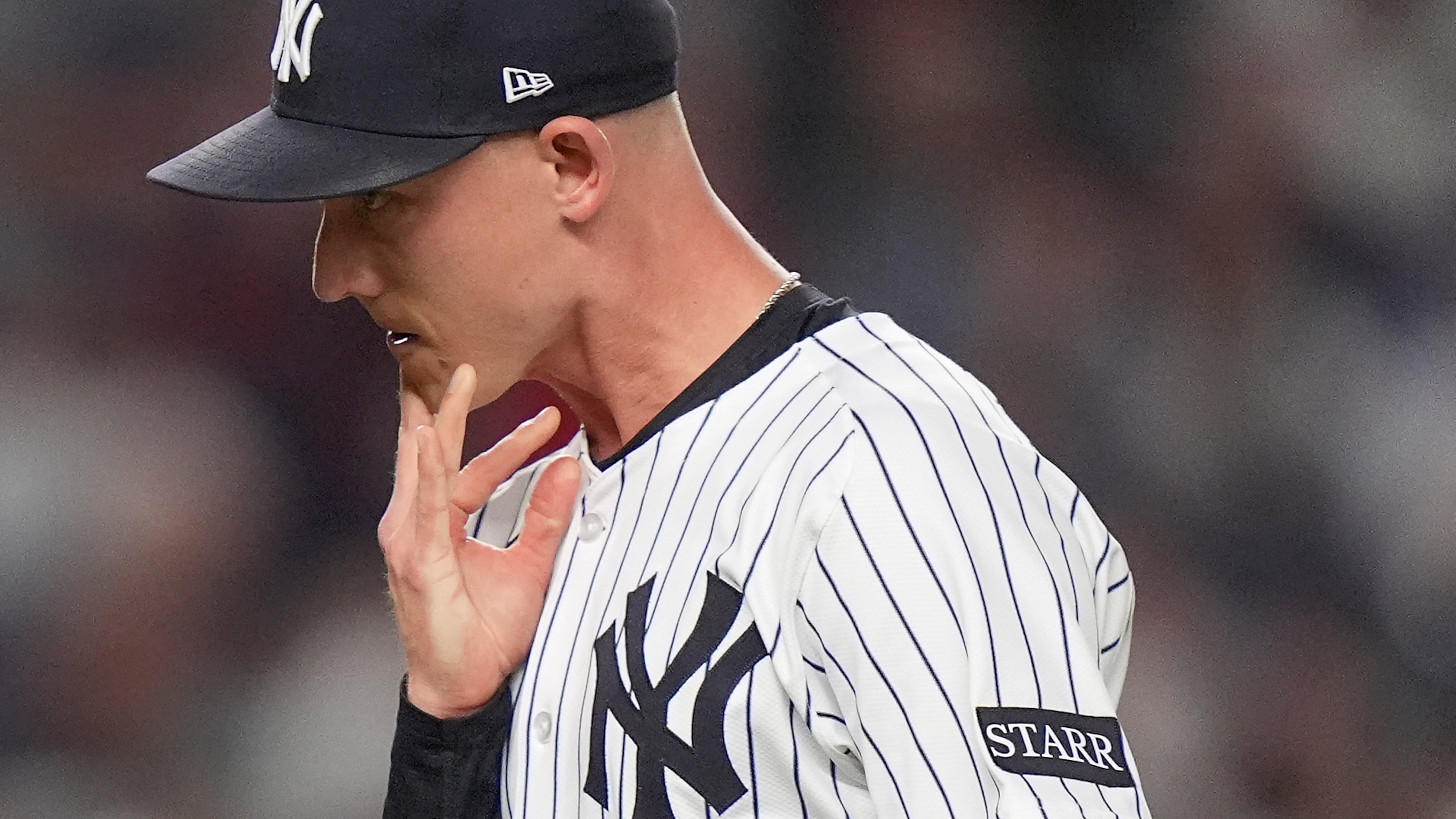 New York Yankees pitcher Luke Weaver reacts as he walks off the field after giving up two runs to the Boston Red Sox during the seventh inning of Game 1 of an American League wild-card baseball playoff series, Tuesday, Sept. 30, 2025, in New York. (AP Photo/Frank Franklin II)