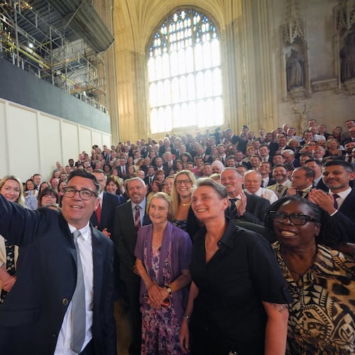 Andy Burnham with colleagues from the Parliamentary Labour Party in Westminster Hall at the Houses of Parliament in central London, as he returns to the House of Commons to take up his seat after winning the Makerfield by-election, Monday June 22, 2026. (Yui Mok/PA via AP)