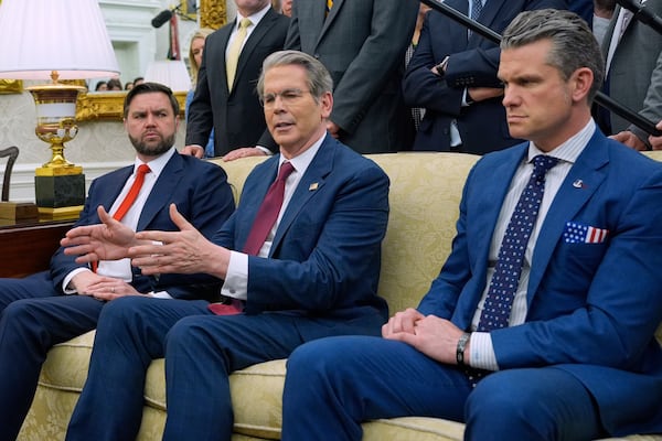 Treasury Secretary Scott Bessent speaks as Vice President JD Vance and Defense Secretary Pete Hegseth listen as President Donald Trump meets with Italy's Prime Minister Giorgia Meloni in the Oval Office of the White House, Thursday, April 17, 2025, in Washington. (AP Photo/Alex Brandon)