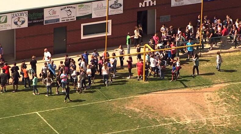 Officials investigated a bomb threat at North Hall Middle School. Students were evacuated to North Hall High School’s football stadium. (Credit: Channel 2 Action News)