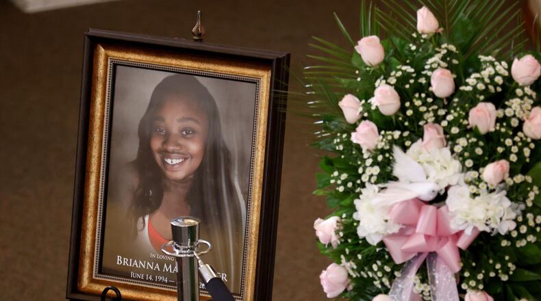 A photograph of Brianna Grier is shown at her funeral. The 28-year-old mother of twin girls died in July of last year after falling out of a moving police car, authorities said. (Jason Getz/The Atlanta Journal-Constitution/TNS)