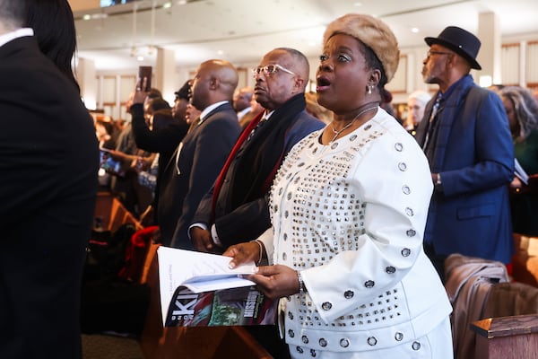 A woman sings during worship at the Martin Luther King Jr. Beloved Community Commemorative Service at Ebenezer Baptist Church in Atlanta on Monday, Jan. 19, 2026. (Abbey Cutrer/AJC)