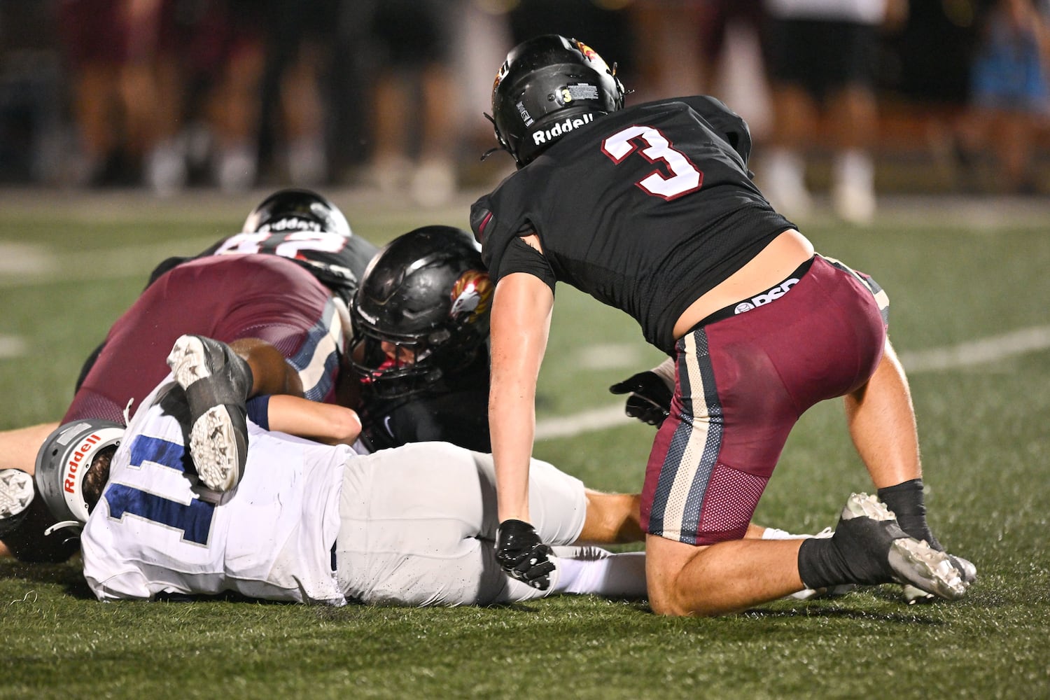 East Jackson quarterback Jayden Gibson is sacked by Hebron defensive lineman Keith Becker (right) during the first half of play Friday, Sept. 26, 2025, at Hebron Christian Academy. (Daniel Varnado for the AJC)