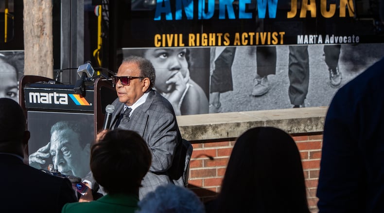 At a ceremony unveiling a new MARTA bus featuring Andrew Young, the former Atlanta Mayor Andrew Young speaks at the event with the new bus behind him where he is among six mayors at the event at the Ray Charles Performing Arts Center at Morehouse College on Friday, November 15, 2024. (Jenni Girtman for The Atlanta Journal-Constitution)