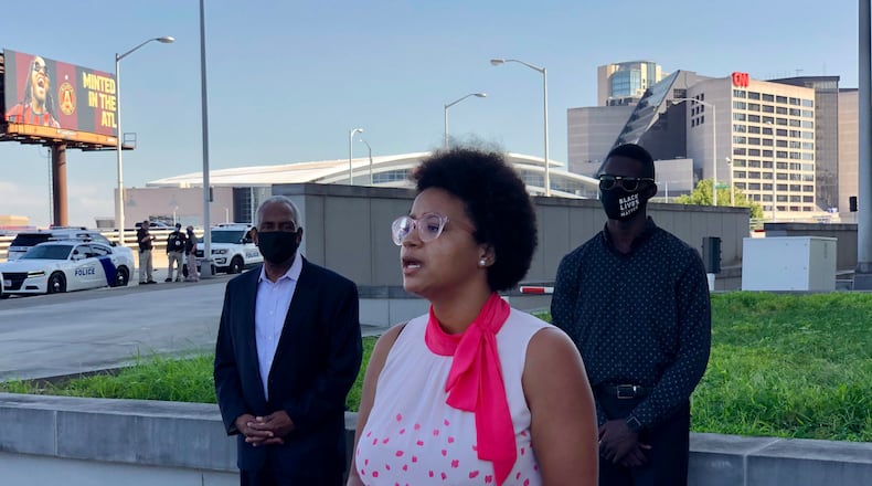 Brionté McCorkle speaks about a lawsuit seeking to end at-large elections for the Georgia Public Service Commission outside the Richard B. Russell Federal Building in Atlanta on Tuesday, July 14, 2020. (Mark Niesse/AJC)