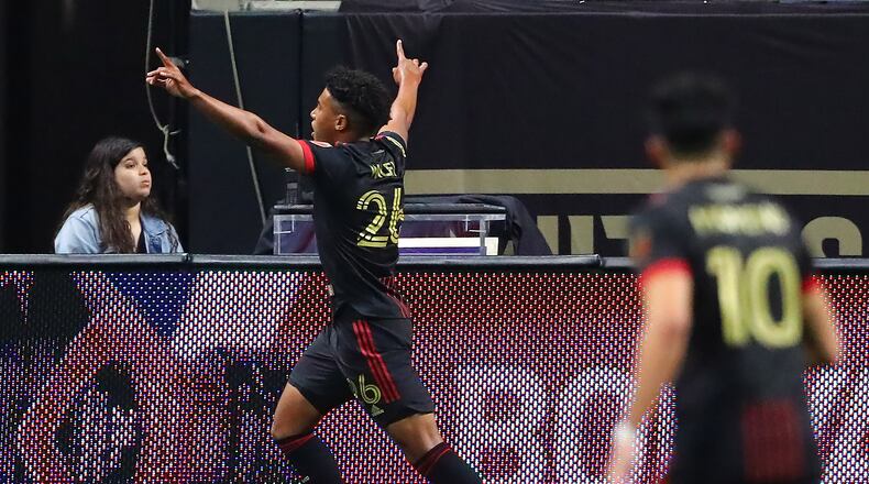 Atlanta United's Caleb Wiley reacts after scoring his first career goal with a kick past Sporting KC goalkeeper Tim Melia for a 3-1 lead and victory in an MLS soccer match Sunday in Atlanta. (Curtis Compton / Curtis.Compton@ajc.com)